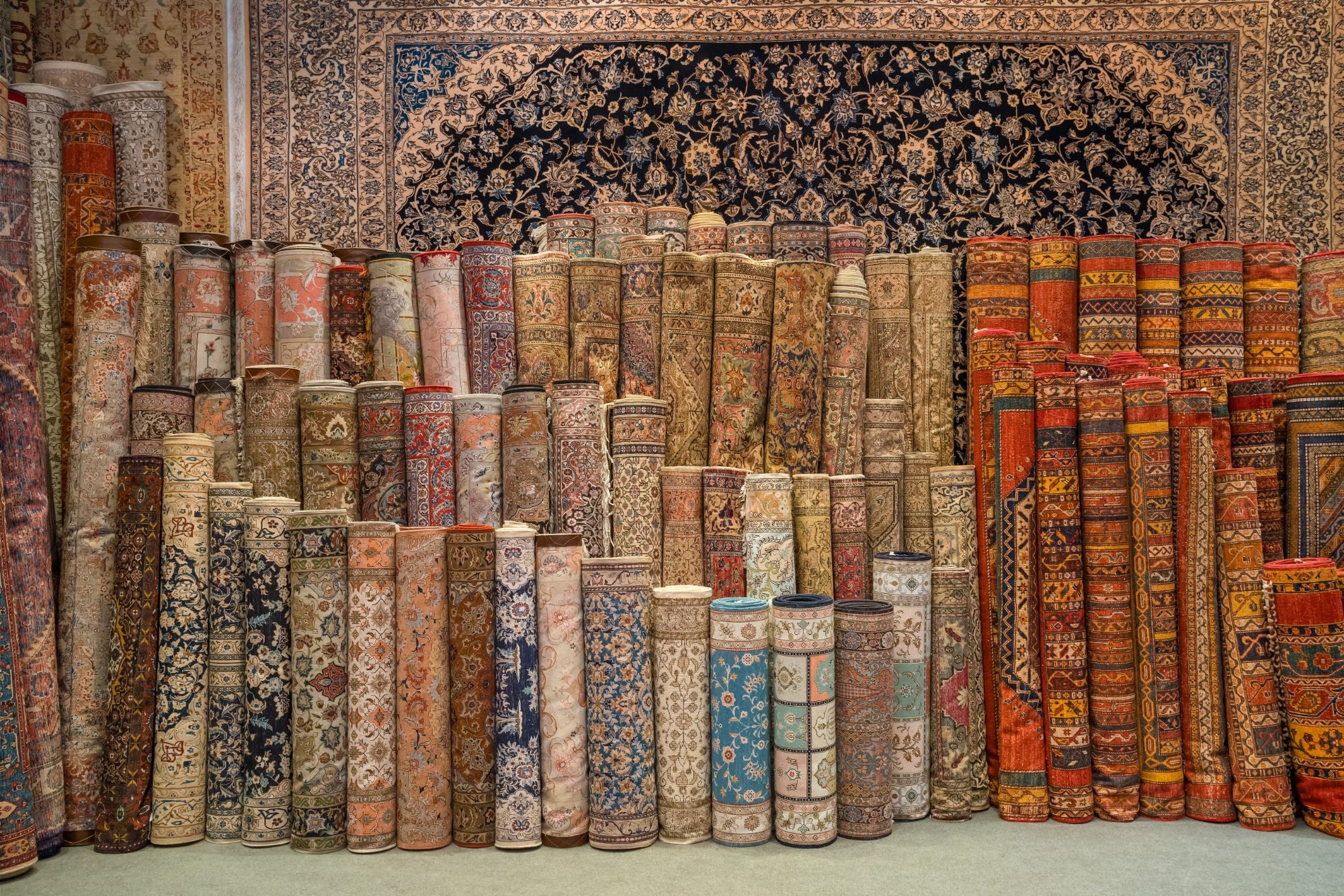 Rolled Oriental rugs stored upright