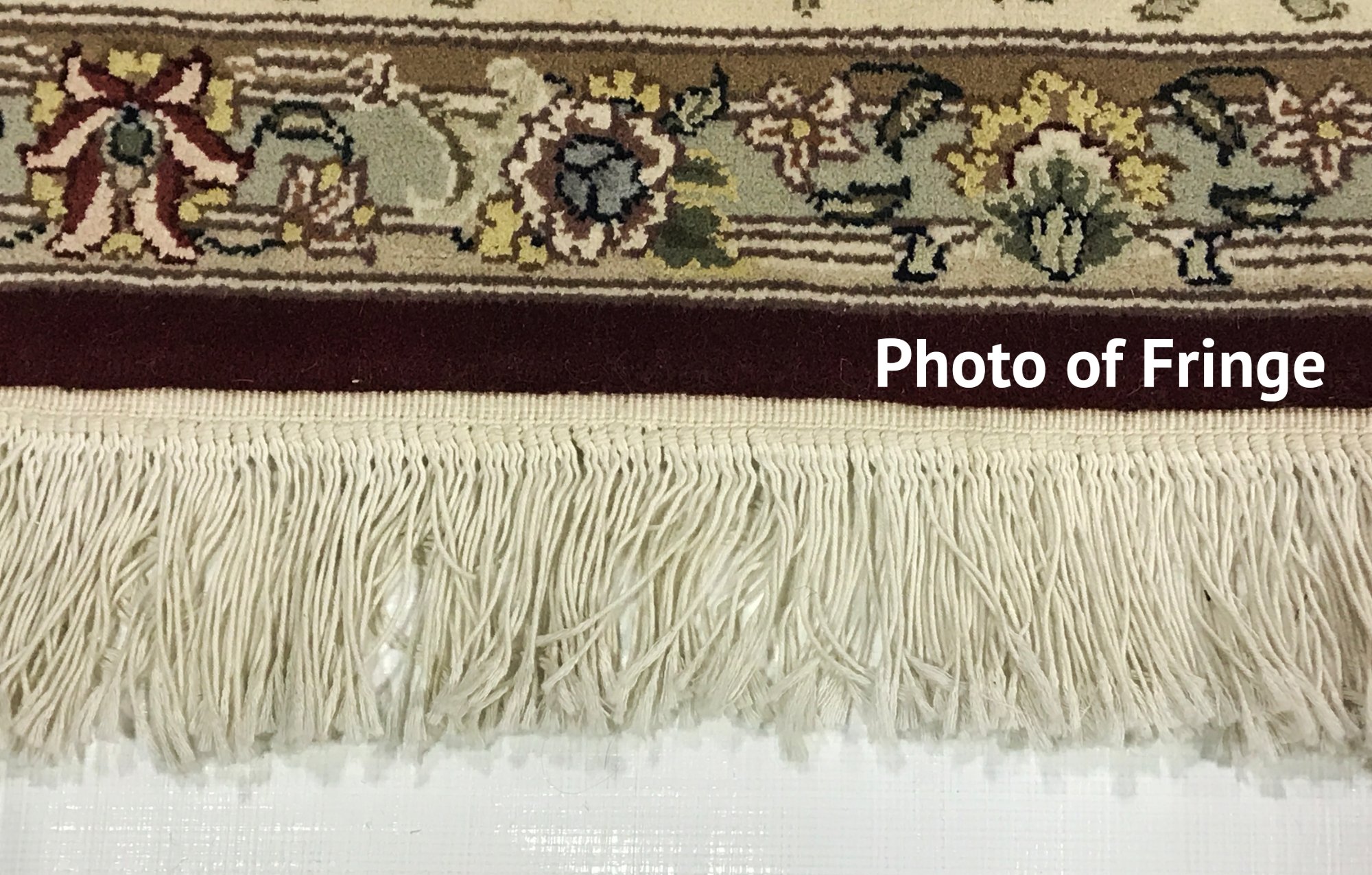 A photograph of a rug’s fringe leading into the pile